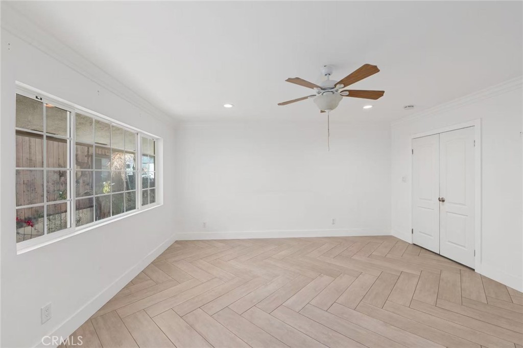 10566 Calabash Avenue Fontana, CA 92337 - Photo 9 of 20 wooden floor in an empty room with a window