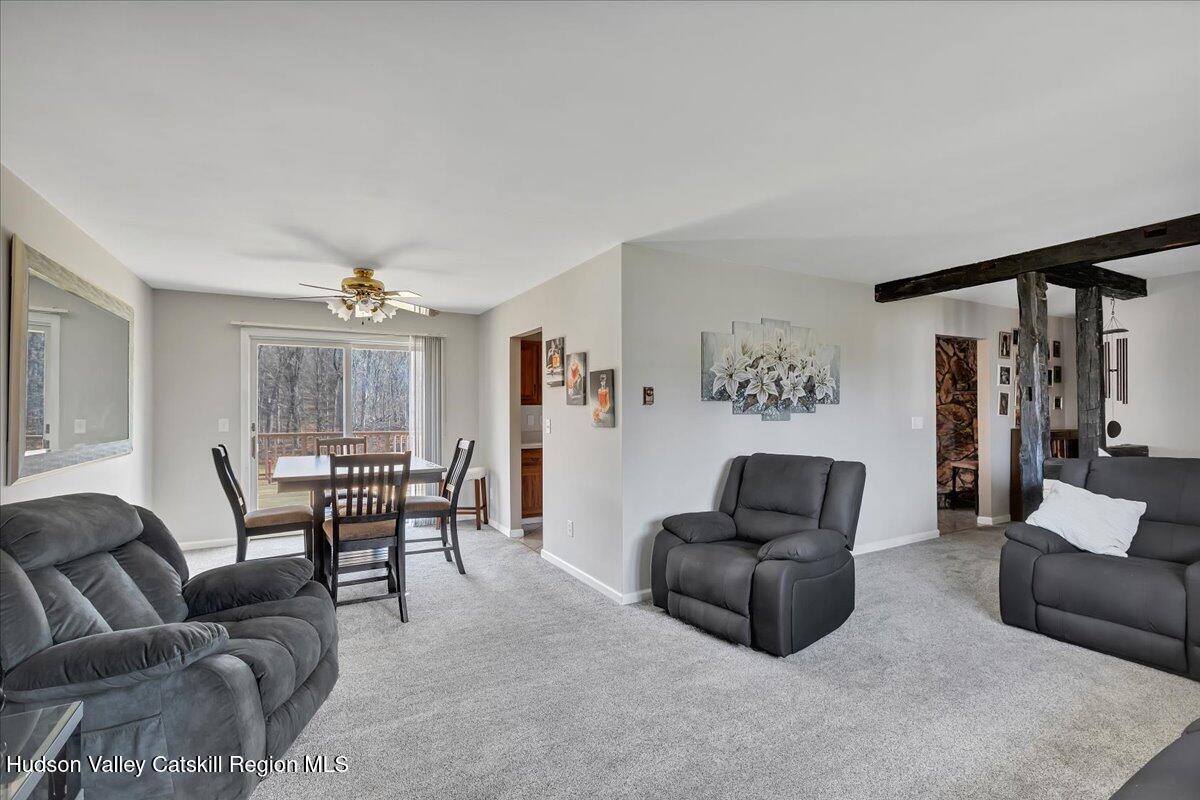 28 Hennett Road Valatie, NY 12184 - Photo 12 of 40 a living room with furniture and a window