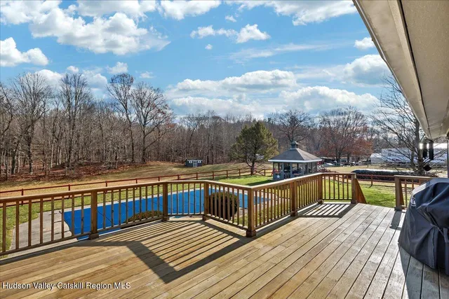 a view of swimming pool with trees and buildings