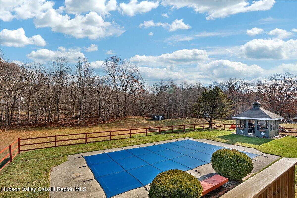 28 Hennett Road Valatie, NY 12184 - Photo 31 of 40 a view of swimming pool with seating space and wooden fence