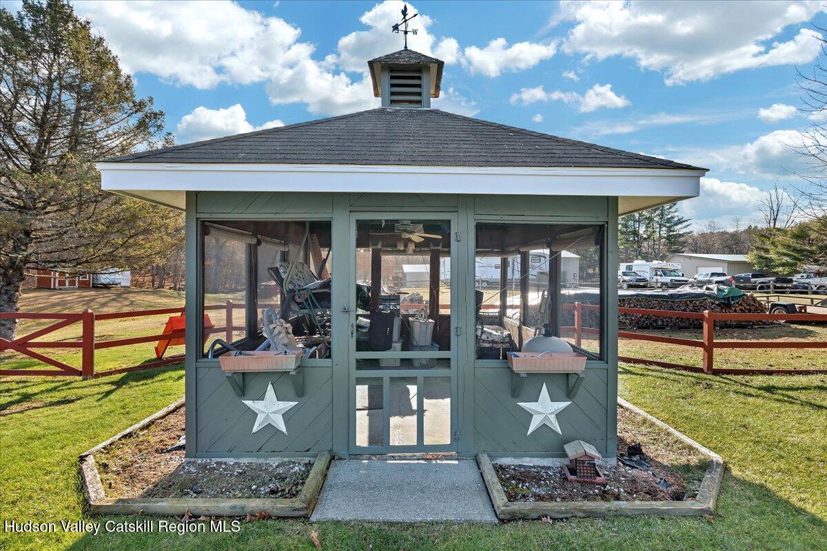 28 Hennett Road Valatie, NY 12184 - Photo 33 of 40 a front view of a house with outdoor seating