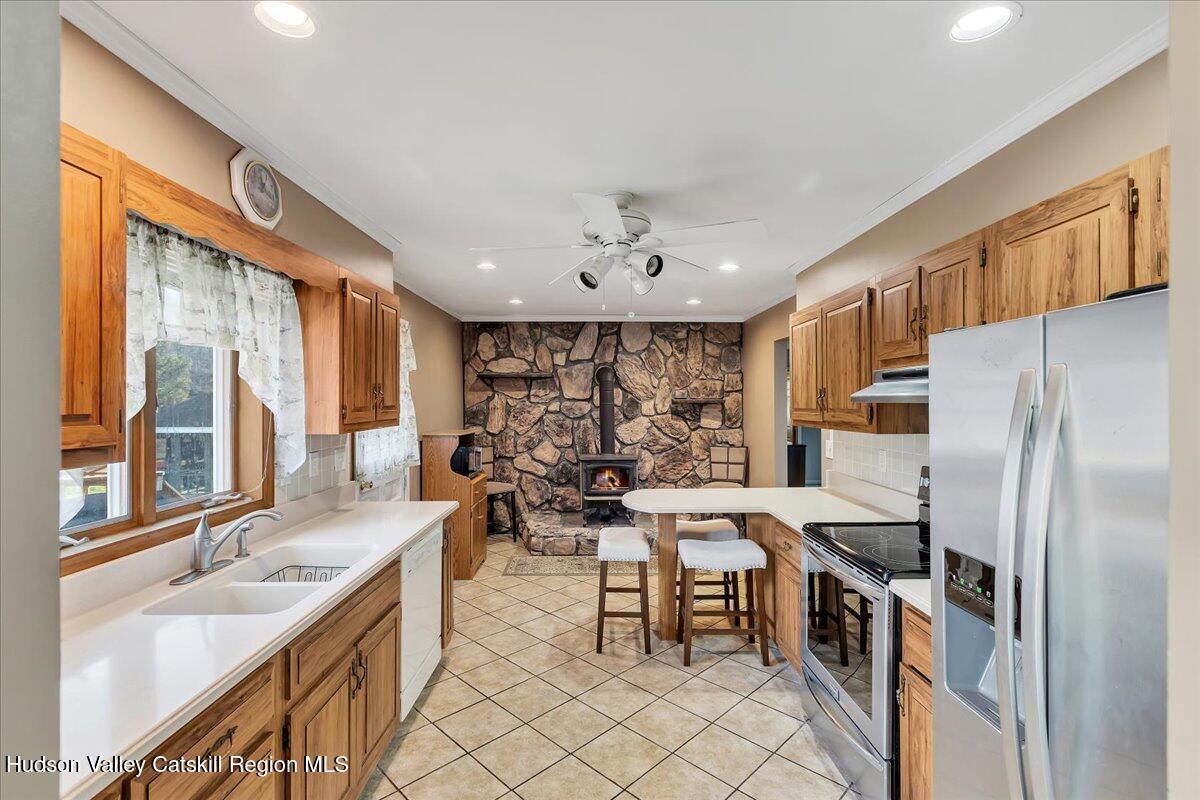 28 Hennett Road Valatie, NY 12184 - Photo 8 of 40 a kitchen with counter top space and stainless steel appliances
