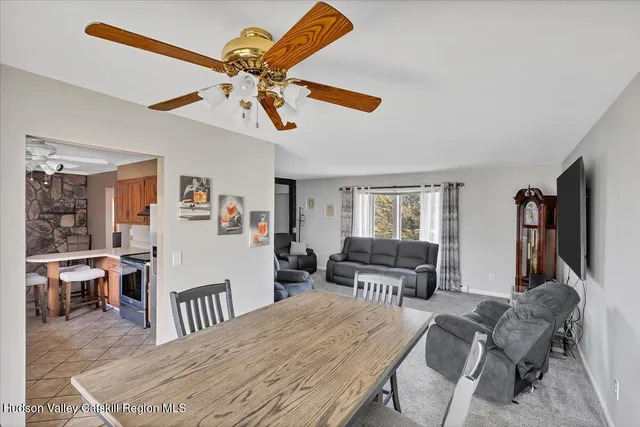 a bedroom with furniture and a large window