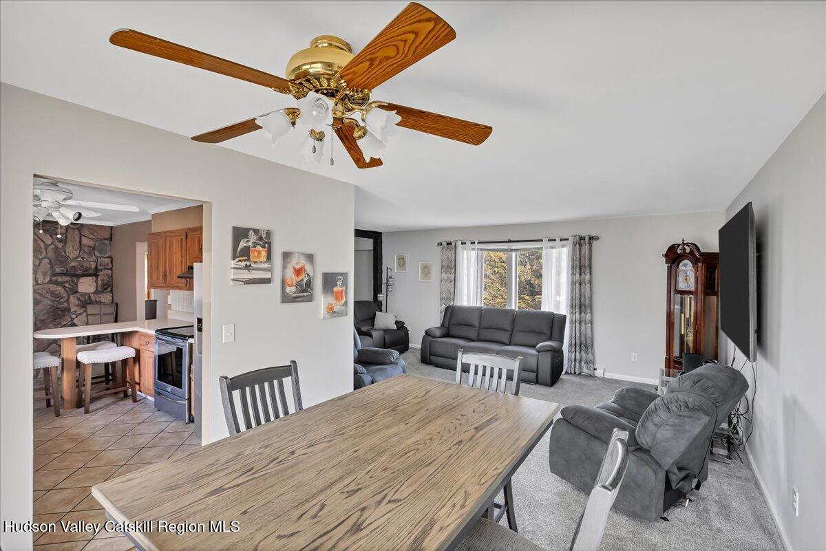 28 Hennett Road Valatie, NY 12184 - Photo 9 of 40 a bedroom with furniture and a large window