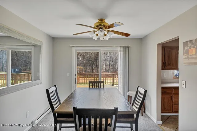 a view of a dining room with furniture window and outside view