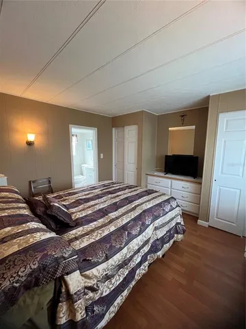 a bedroom with bed and a couch