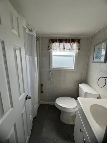 a bathroom with a toilet and a sink