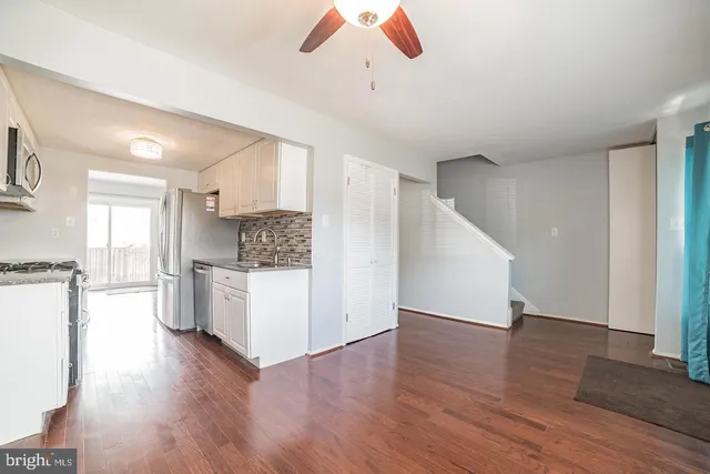 a view of a kitchen cabinets and wooden floor
