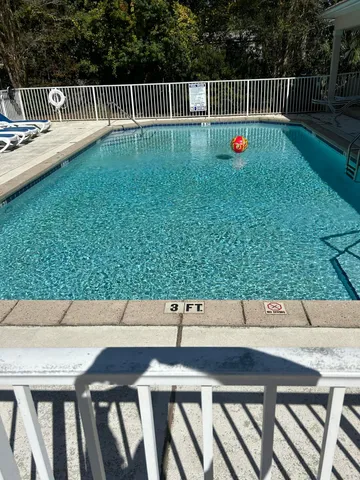 a view of swimming pool from a balcony