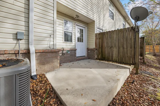 a view of a house with pool and chairs