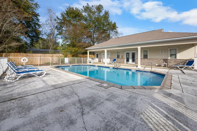 a view of a swimming pool with a lounge chairs