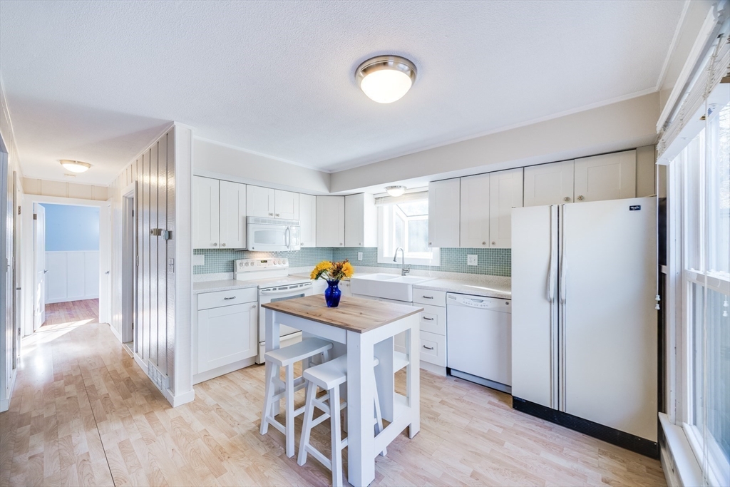 23 Malabar Road Chatham, MA 02633 - Photo 19 of 41 a kitchen with refrigerator cabinets and wooden floor