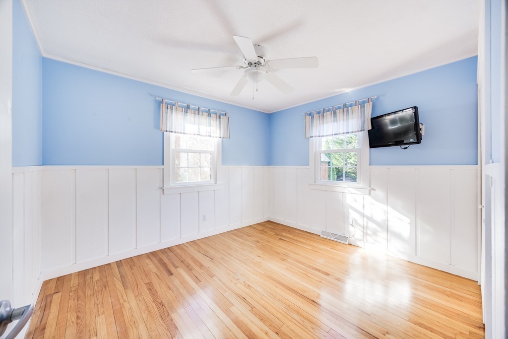 23 Malabar Road Chatham, MA 02633 - Photo 24 of 41 a bedroom with a bed and a flat screen tv
