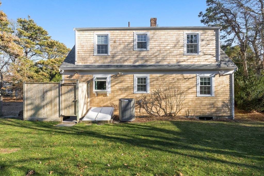 23 Malabar Road Chatham, MA 02633 - Photo 3 of 41 front view of a house with a yard