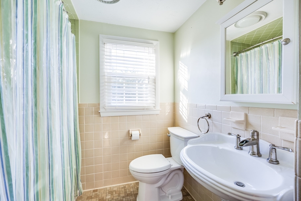 23 Malabar Road Chatham, MA 02633 - Photo 32 of 41 a bathroom with a toilet sink and mirror