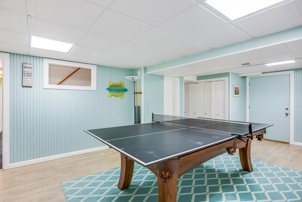 23 Malabar Road Chatham, MA 02633 - Photo 34 of 41 a backyard of a house with a table and chairs