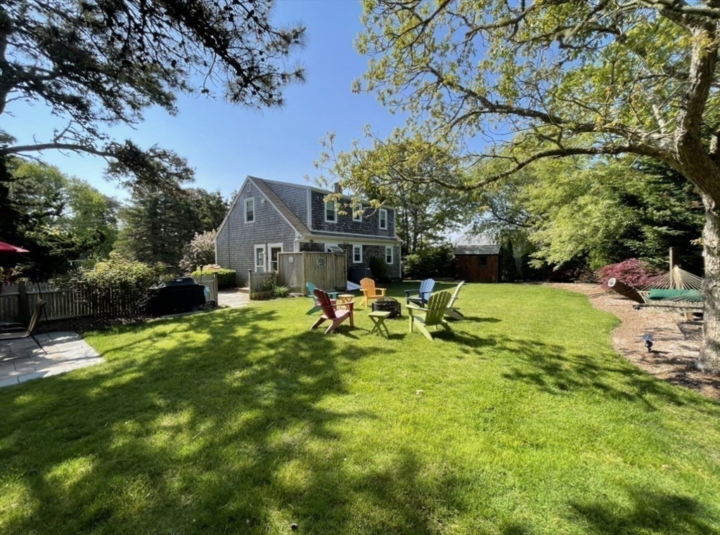 23 Malabar Road Chatham, MA 02633 - Photo 7 of 41 a view of a house with backyard porch and sitting area