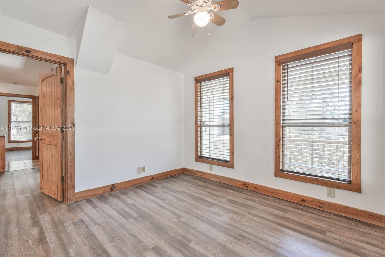 1216 Bugscuffle Road Hiawassee, GA 30546 - Photo 13 of 30 an empty room with wooden floor and windows