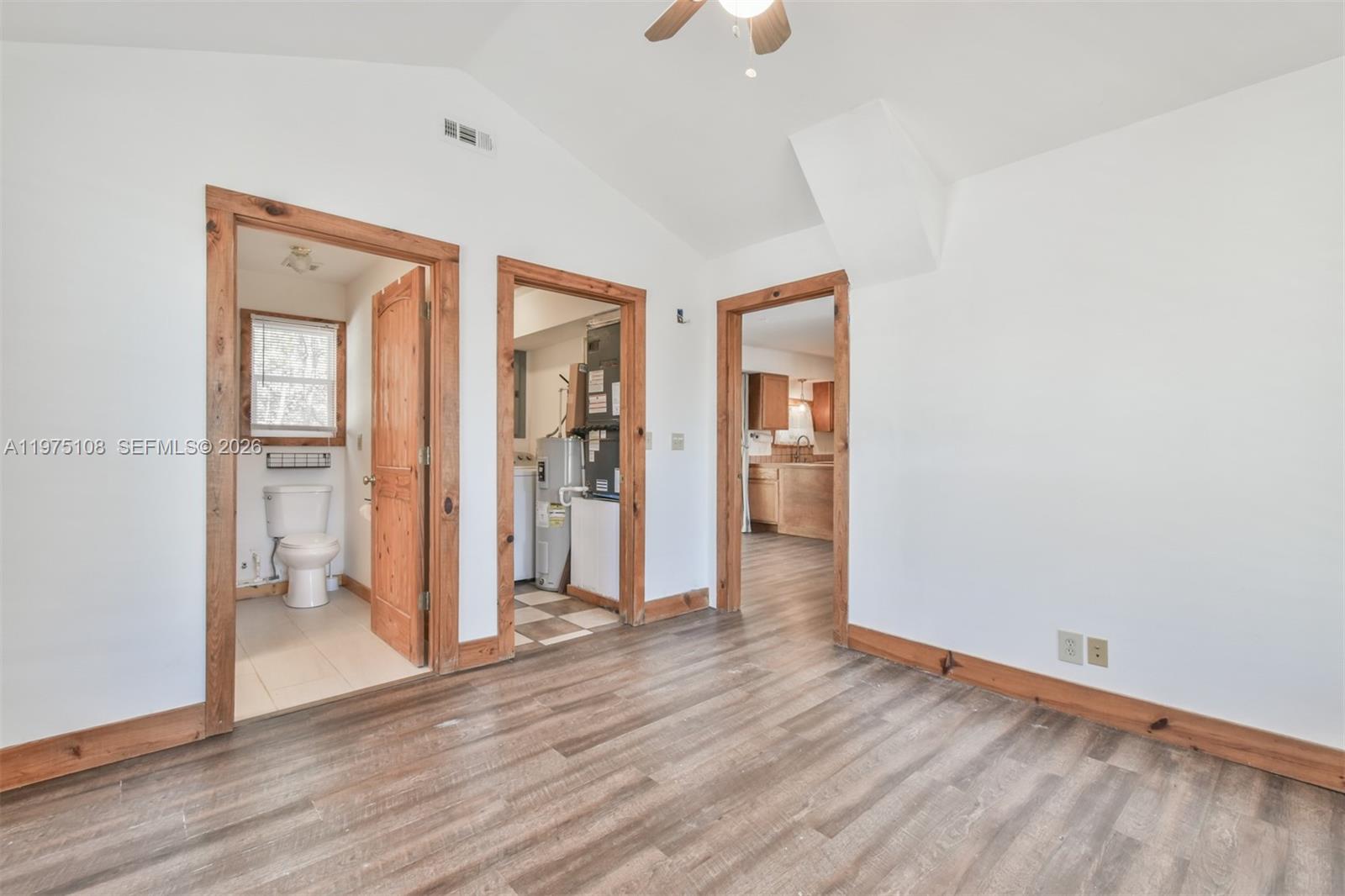 1216 Bugscuffle Road Hiawassee, GA 30546 - Photo 14 of 30 an empty room with wooden floor and windows