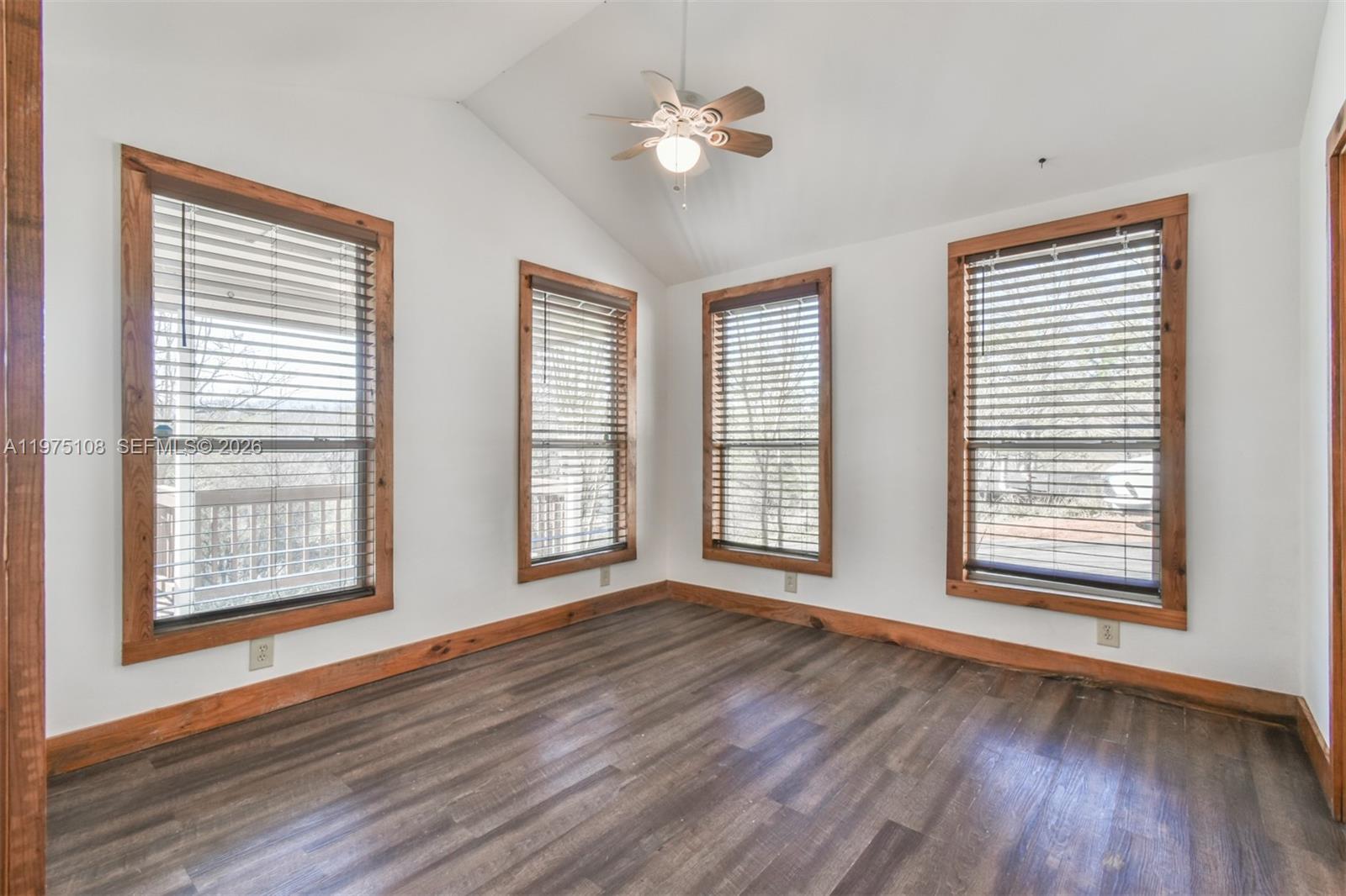 1216 Bugscuffle Road Hiawassee, GA 30546 - Photo 15 of 30 a view of an empty room with wooden floor and a window