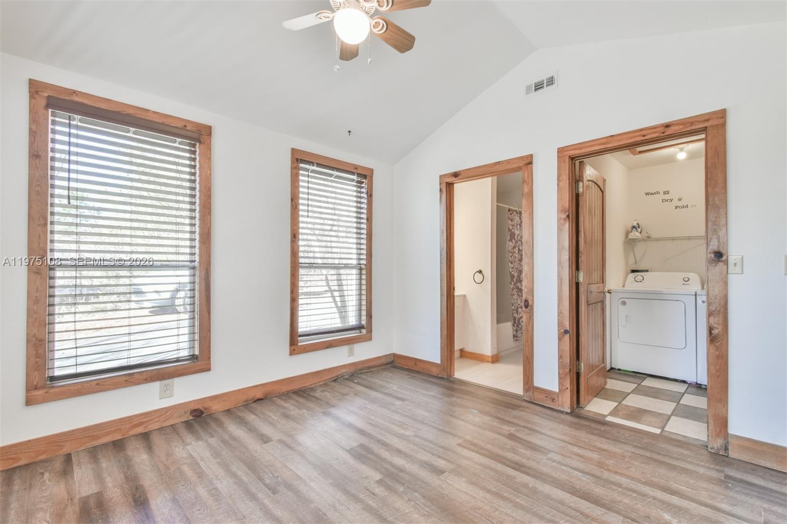 1216 Bugscuffle Road Hiawassee, GA 30546 - Photo 16 of 30 a view of an empty room with a window and wooden floor