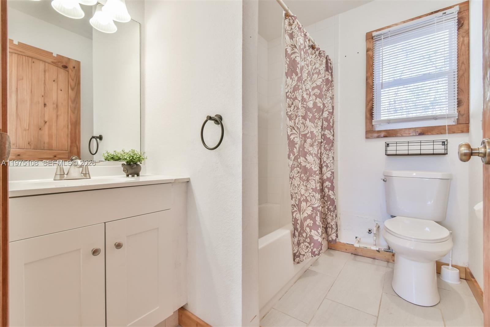 1216 Bugscuffle Road Hiawassee, GA 30546 - Photo 17 of 30 a bathroom with a sink a toilet and shower