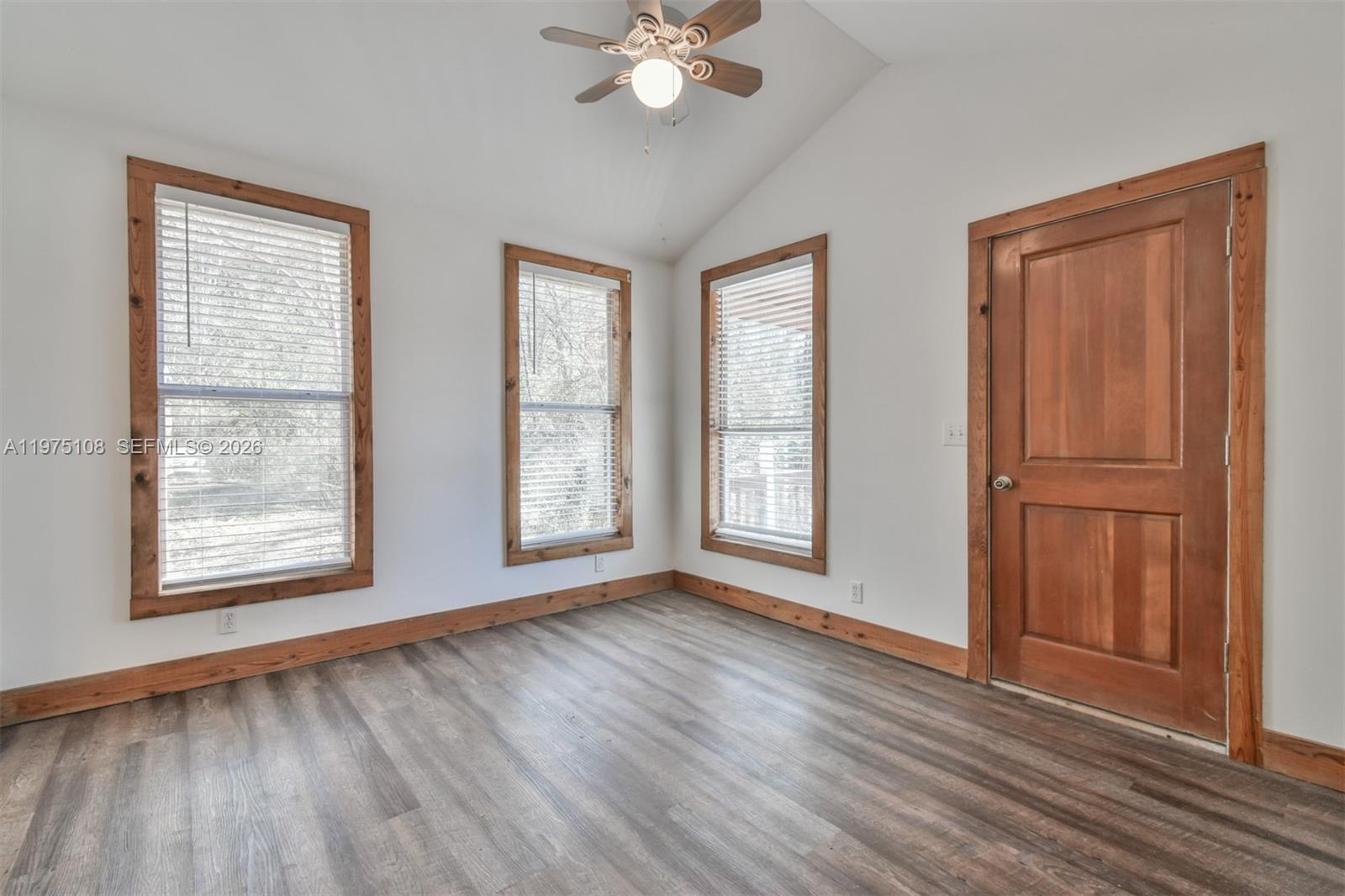 1216 Bugscuffle Road Hiawassee, GA 30546 - Photo 19 of 30 a view of an empty room with wooden floor and a window