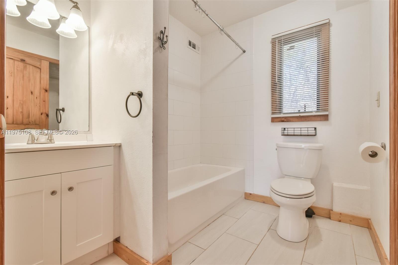 1216 Bugscuffle Road Hiawassee, GA 30546 - Photo 21 of 30 a bathroom with a sink a toilet and shower