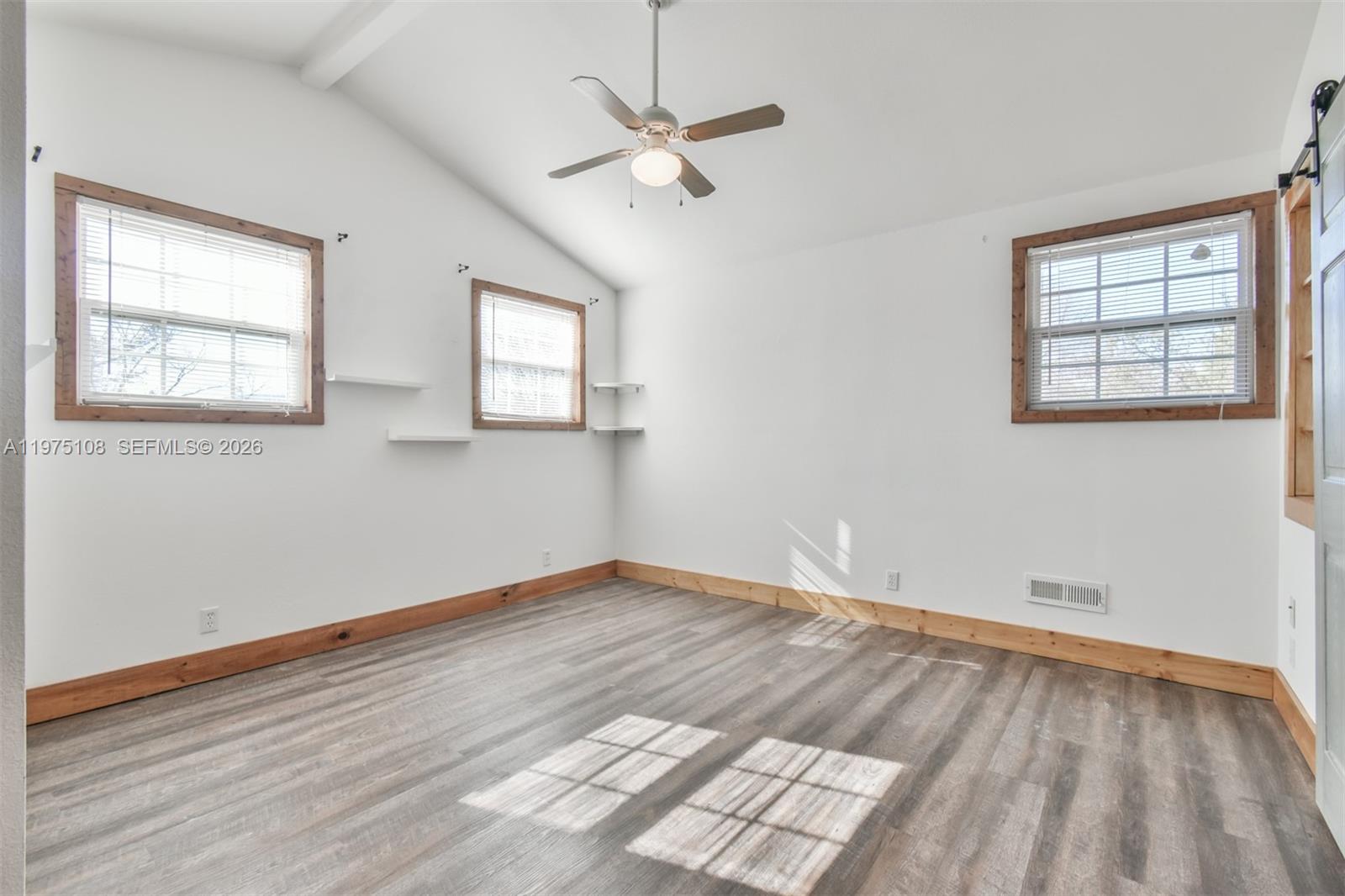 1216 Bugscuffle Road Hiawassee, GA 30546 - Photo 22 of 30 wooden floor in an empty room with a window