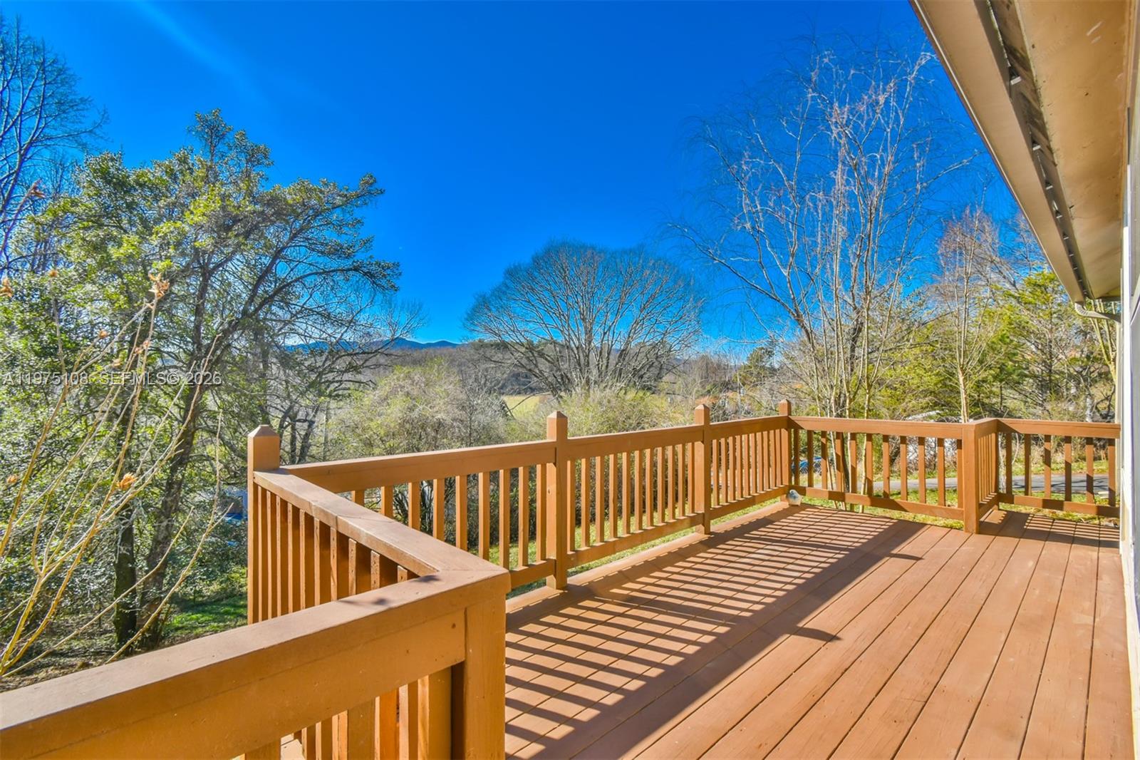 1216 Bugscuffle Road Hiawassee, GA 30546 - Photo 4 of 30 a view of deck with wooden floor and outdoor seating
