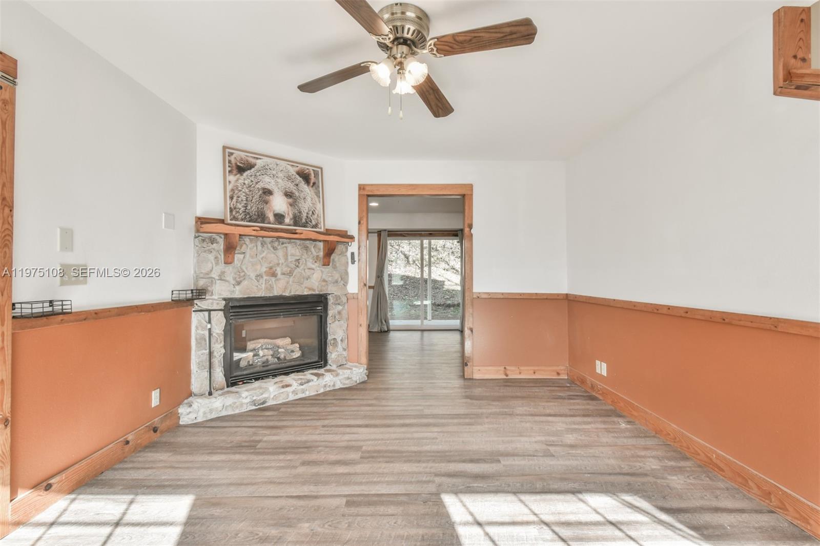 1216 Bugscuffle Road Hiawassee, GA 30546 - Photo 6 of 30 a view of livingroom with hardwood floor and a ceiling fan