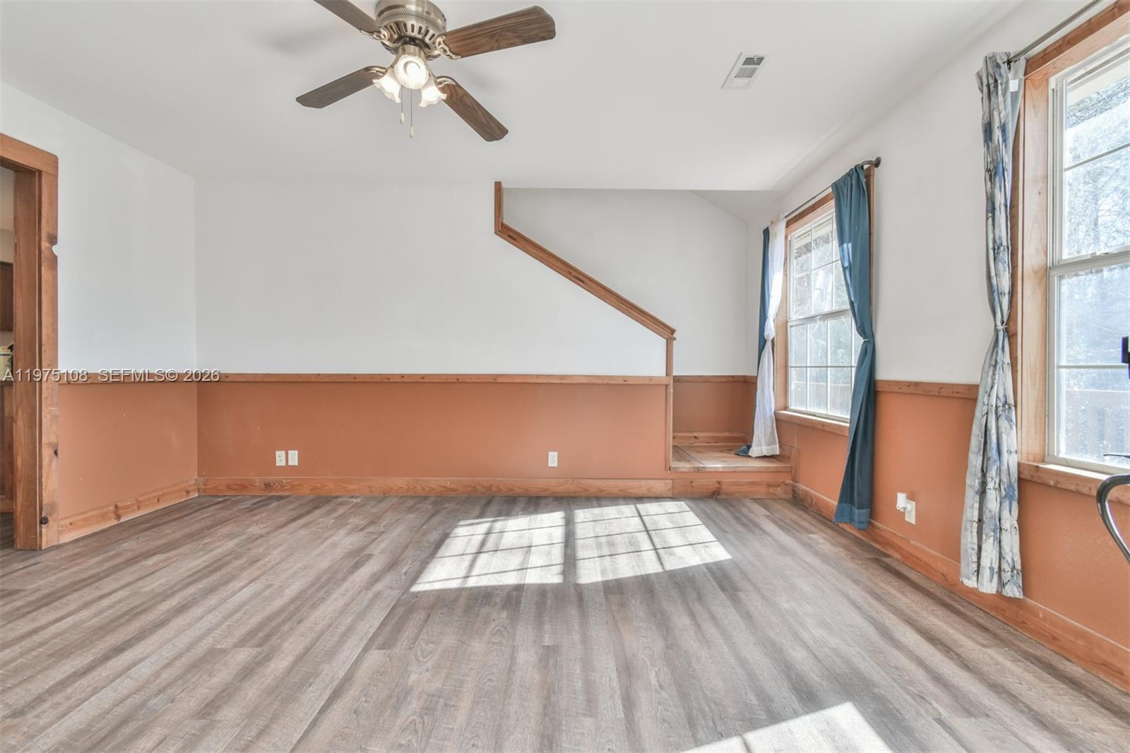 1216 Bugscuffle Road Hiawassee, GA 30546 - Photo 7 of 30 wooden floor in an empty room with a window