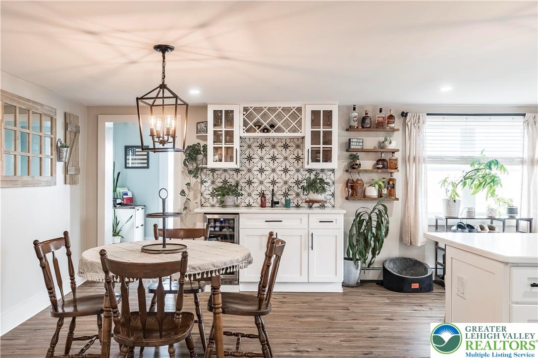 7056 Behler Road New Tripoli, PA 18066 - Photo 3 of 12 a view of a dining room with furniture wooden floor and chandelier