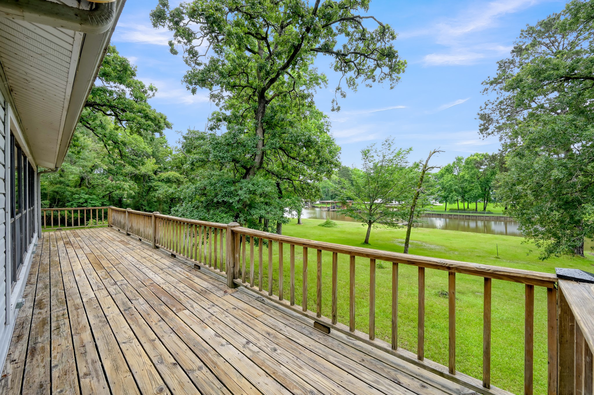 254 Sharp Lane Trinity, TX 75862 - Photo 4 of 36 a view of balcony with wooden floor and fence