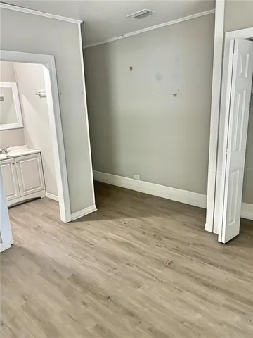 a white toilet sitting next to a bath tub