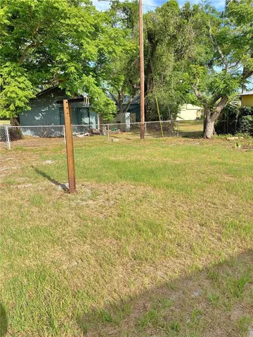 a view of a door of a house with a yard