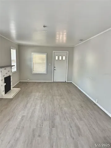 a view of a house with a small yard and plants