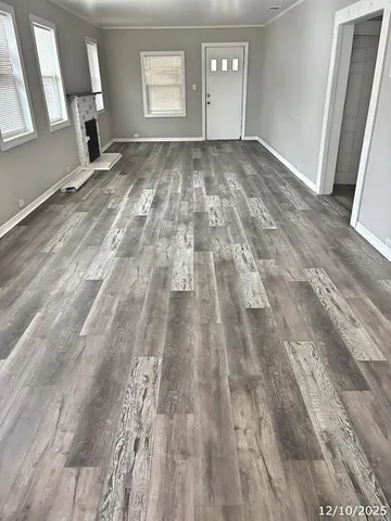 a view of empty room with window and stairs