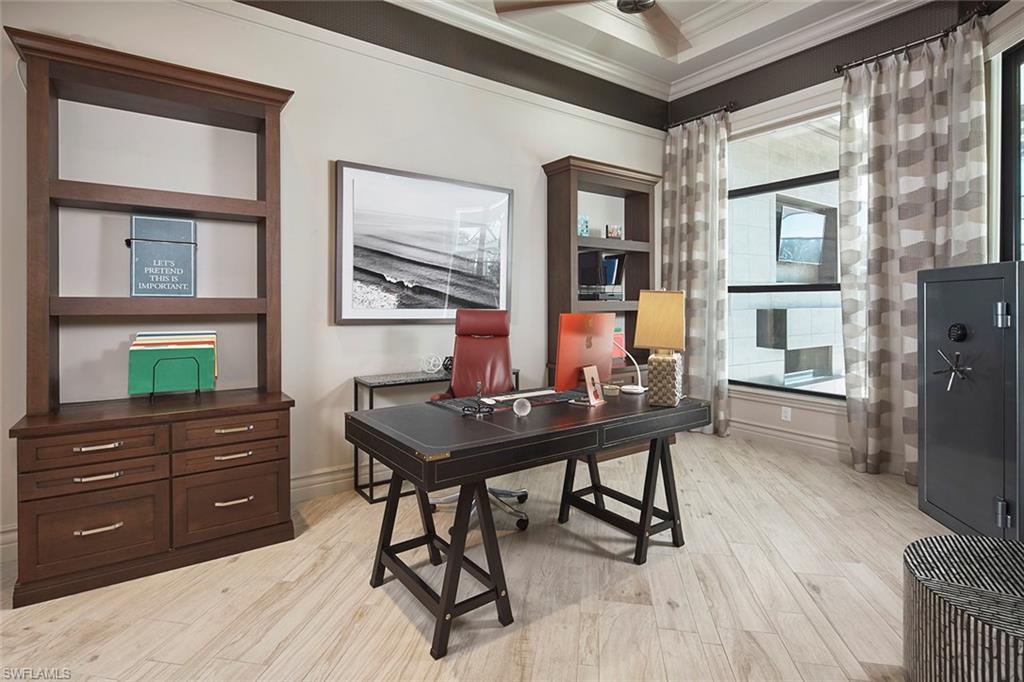 16434 Seneca Way Naples, FL 34110 - Photo 10 of 34 a view of a workspace room with furniture and wooden floor