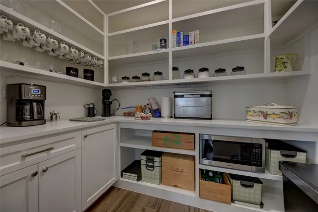 a kitchen with a stove and cabinets