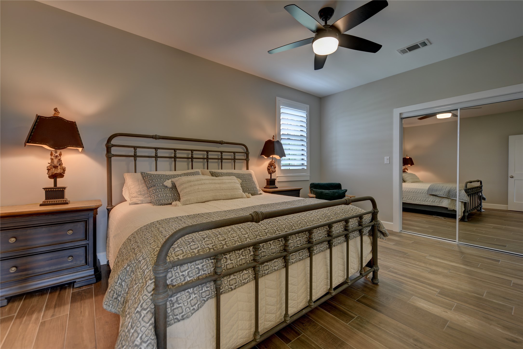 2055 Randle Hill Road Brenham, TX 77833 - Photo 15 of 23 a bedroom with a bed and wooden floor