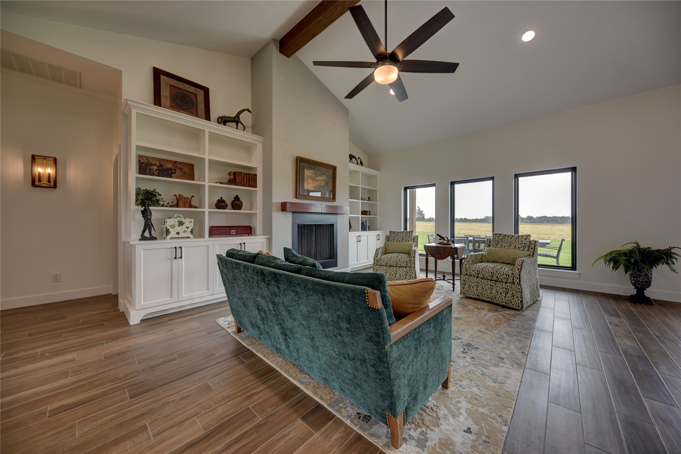 2055 Randle Hill Road Brenham, TX 77833 - Photo 17 of 23 a living room with furniture wooden floor and a fireplace