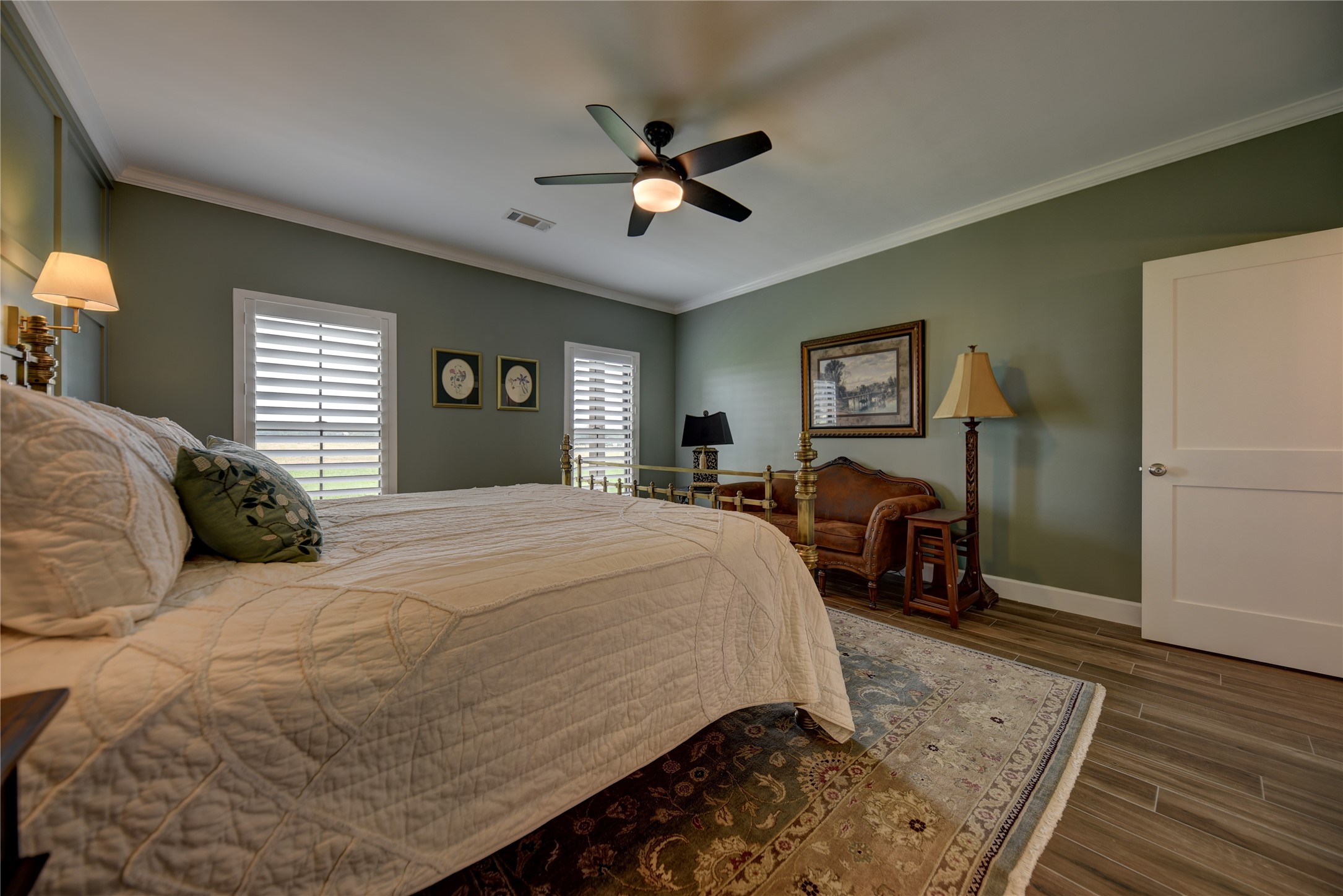 2055 Randle Hill Road Brenham, TX 77833 - Photo 23 of 23 a spacious bedroom with a bed a dresser and potted plant