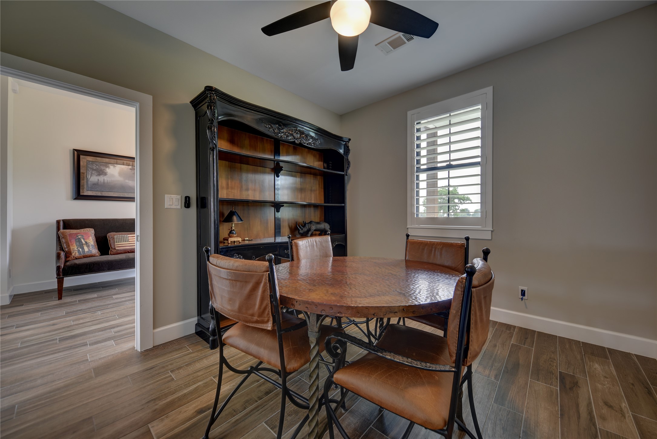2055 Randle Hill Road Brenham, TX 77833 - Photo 8 of 23 a view of a dining room with furniture window and wooden floor