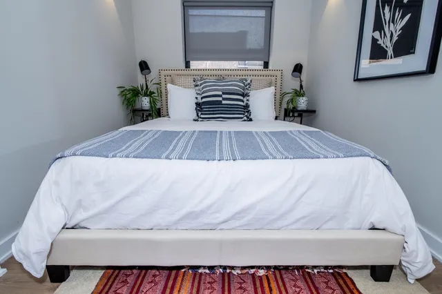 a close up of a bed in a room