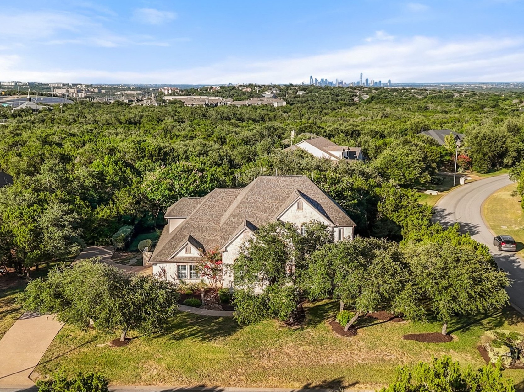 8215 Dark Ridge Cove Austin, TX 78737 - Photo 2 of 40 8215 Dark Ridge Cove is a beautifully updated estate home set on an oversized corner lot in the prized Estates of Loma Vista neighborhood.