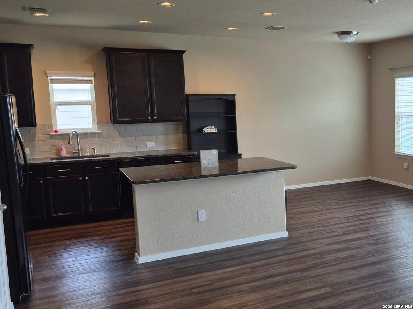 7102 Zuma Beach Converse, TX 78109 - Photo 6 of 31 a kitchen with wooden cabinets and a granite counter top