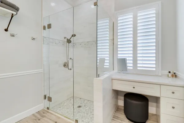 a bathroom with a shower and a sink
