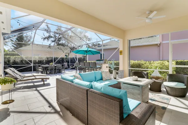 a view of a patio with couches chairs dining table and chairs