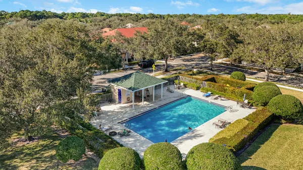 an aerial view of a house with a yard basket ball court and outdoor seating